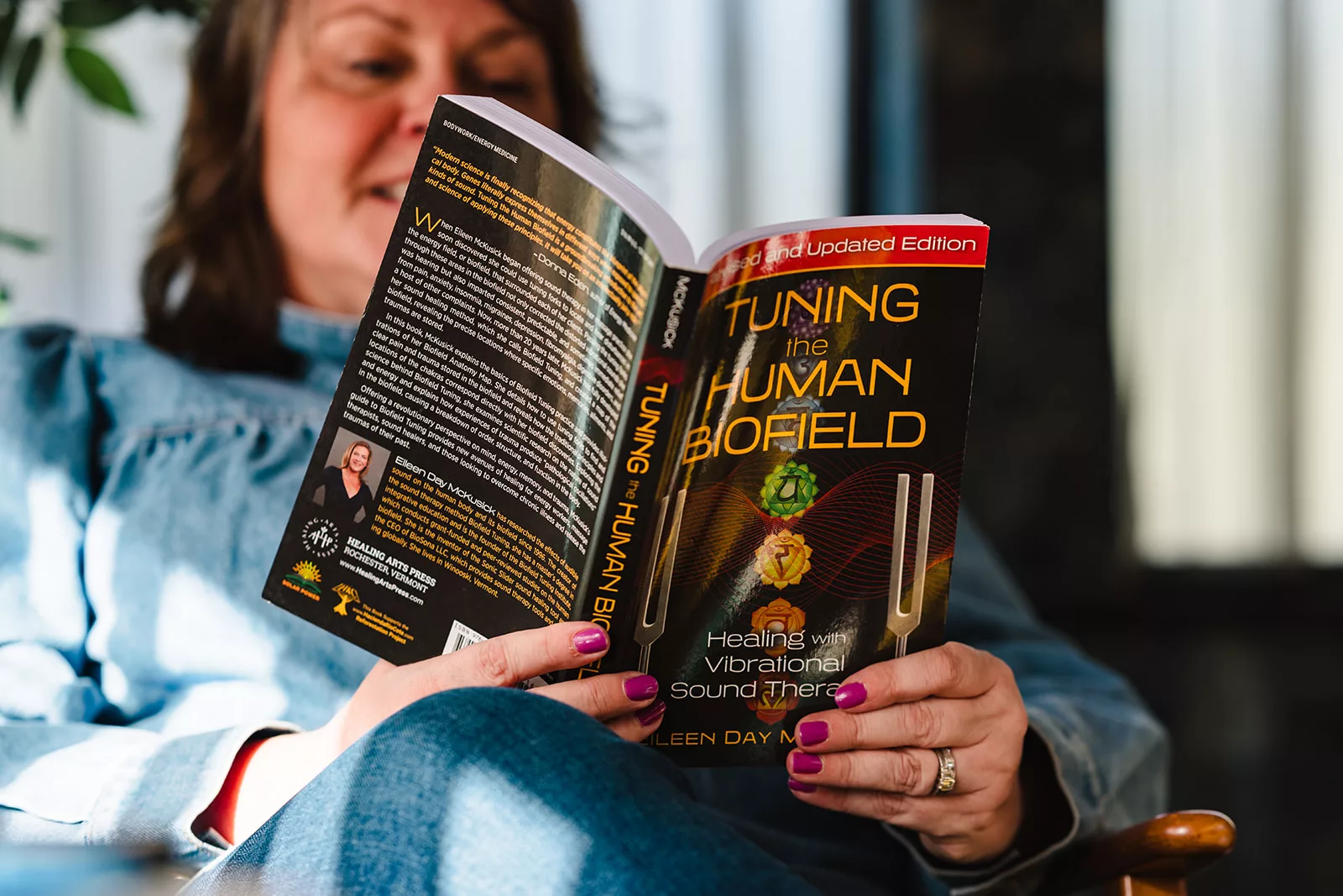 Kellie Rose reading Eileen Day McKusick's book Tuning the Human Biofield while looking into whether Biofield Tuning works